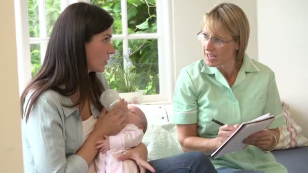 Mother With Baby Meeting With Health Visitor - Filmmaterial, Video