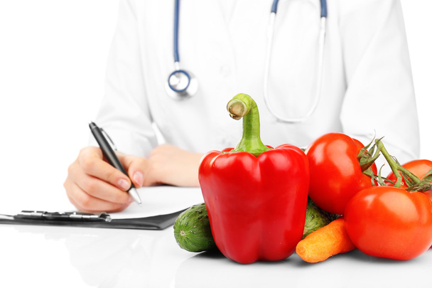 Nutritionist Doctor writing diet plan - Foto, imagen