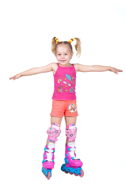 Cute roller skating little girl isolated on white background - Фото, зображення