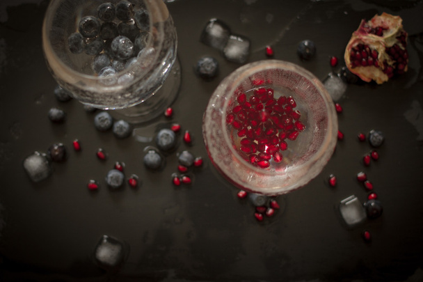drink with blueberries and pomegranate groceries  - Fotoğraf, Görsel