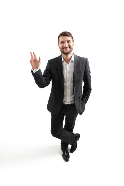 man in formal wear waving his hand - Фото, изображение