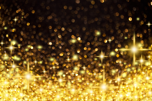 Gouden kerst verlichting en sterren achtergrond - Foto, afbeelding