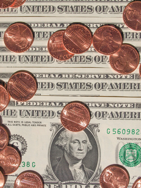 moedas e notas em dólares
 - Foto, Imagem