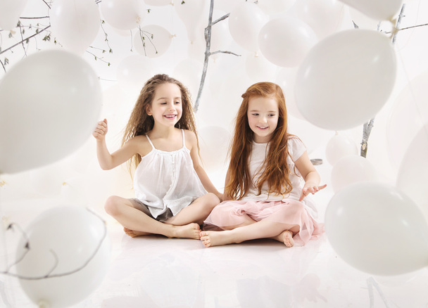 Two joyful girls playing together - Valokuva, kuva