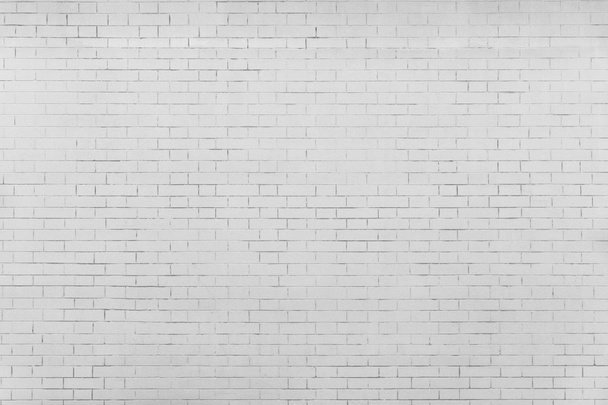 the pale gray textured surface of a brick wall - Photo, Image