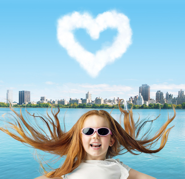 Ginger girl with a heartshaped cloud - Photo, Image