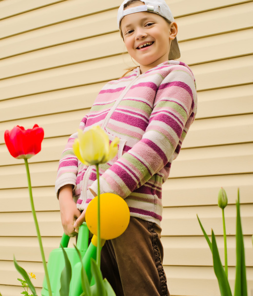 The young girl with a watering can - Photo, Image