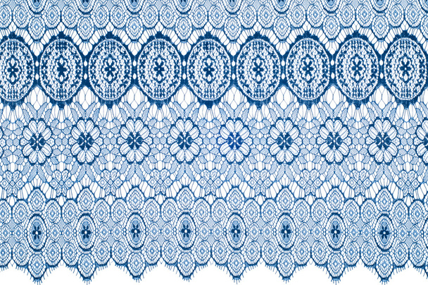 Texture lace fabric. lace on white background studio. thin fabric made of yarn or thread. typically one of cotton or silk, made by looping, twisting, or knitting thread in patterns - Photo, Image