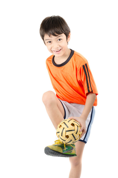 Little boy taking sepak takraw on white background - Photo, Image