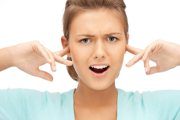 Woman with fingers in ears - Foto, imagen