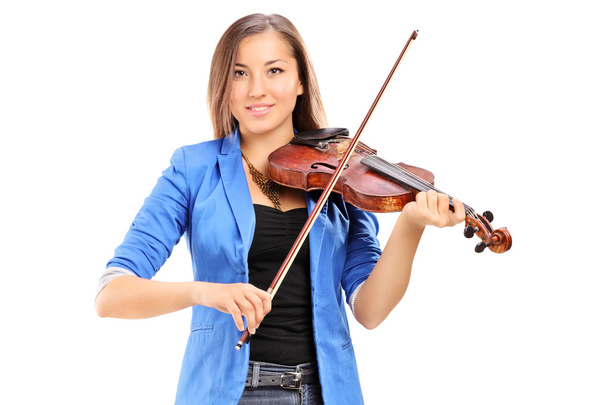 Young female artist playing a violin - Φωτογραφία, εικόνα