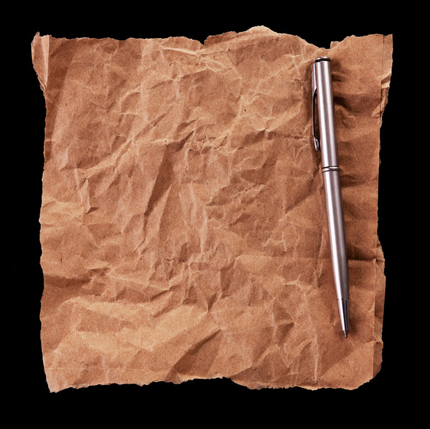 Crumpled sheet of paper and a pen - Fotó, kép