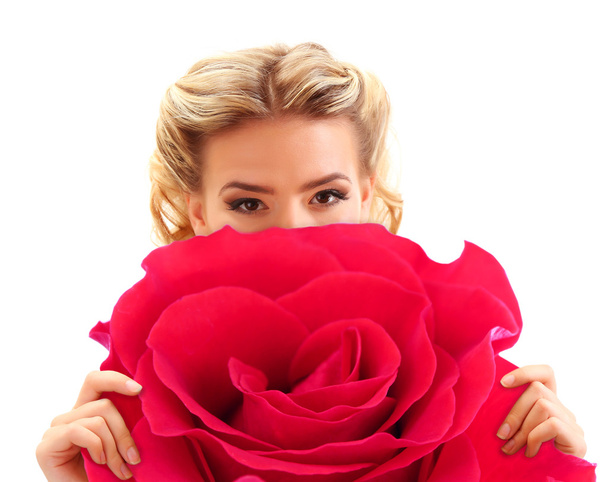 Beautiful young woman holding big red flower isolated on white - Foto, afbeelding