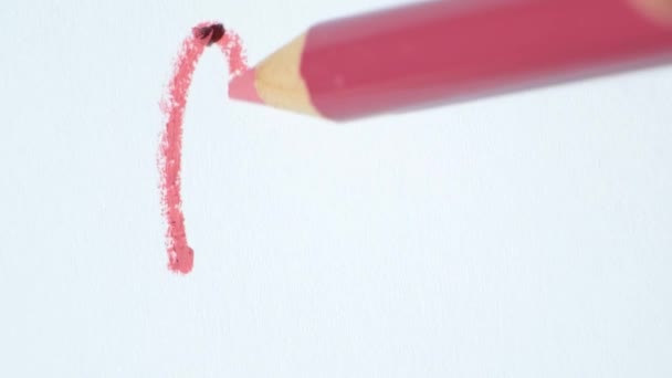 Curved Line Drawn With Pink Lip Liner On White Background - Felvétel, videó