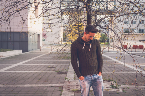 Young  man posing in an urban context - Fotoğraf, Görsel