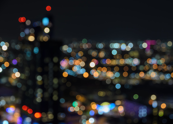 Blurred city lights bokeh illuminated at night - Photo, Image