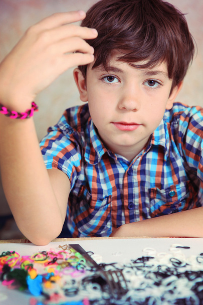 preteen hansome boy show  the result of his rainbow loom hobby p - Photo, Image