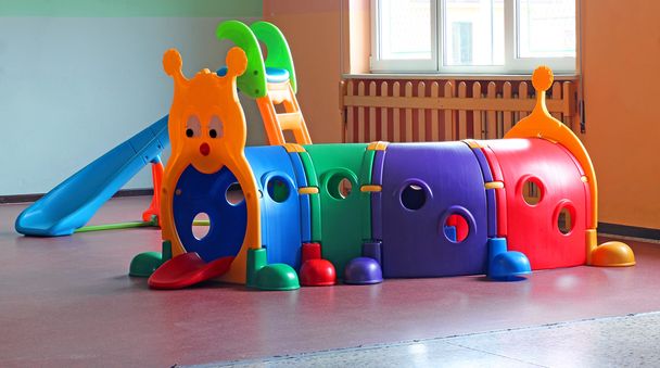 plastic tunnel for children's play in preschool hall - Photo, Image