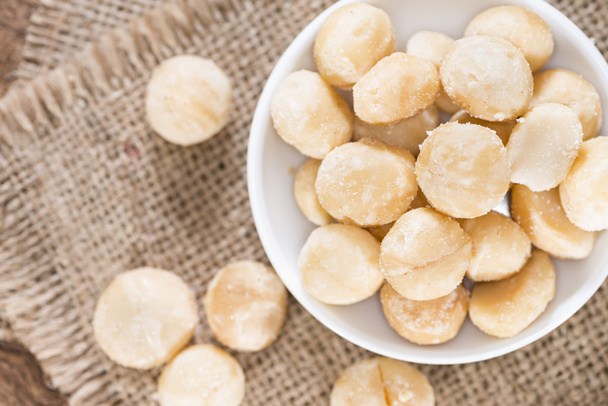 Macadamia nuts on plate - Photo, Image