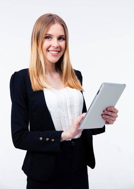 Smiling businesswoman using tablet computer - Фото, изображение
