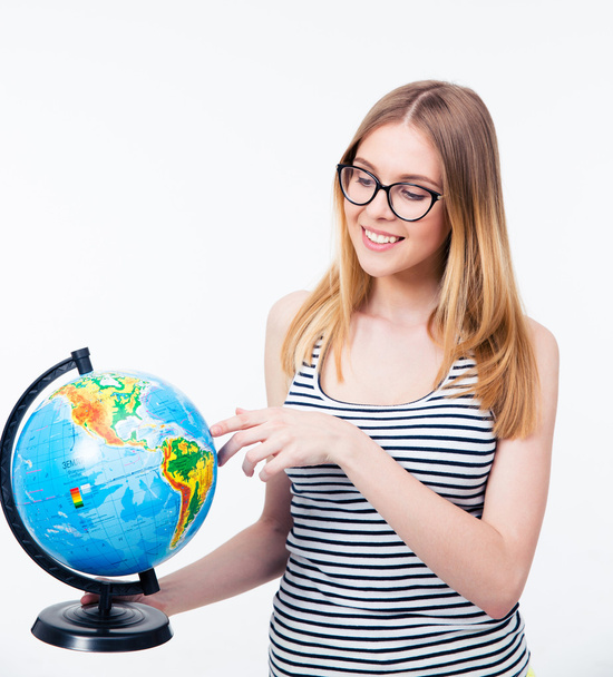 Smiling woman in glasses holding world globe - Foto, afbeelding