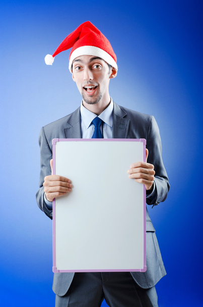 Businessman with santa hat and message - Фото, изображение