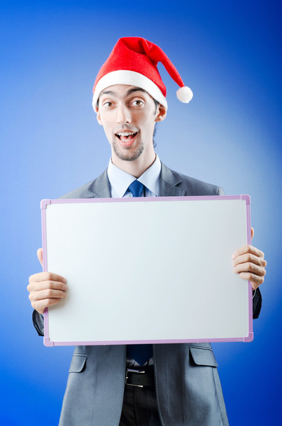 Businessman with santa hat and message - Zdjęcie, obraz
