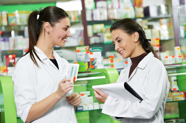 Pharmacy chemist women in drugstore - Foto, imagen