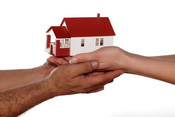 Hands holding miniature house - Photo, Image