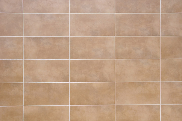 Brown ceramic tiles with white fugue on wall  - Photo, Image