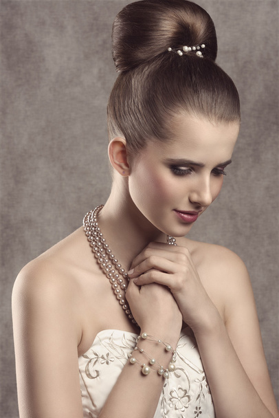 elegant girl with pearls  - Фото, изображение