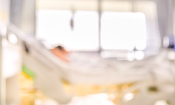 blurred image of Patient with drip in hospital for background us - Photo, Image