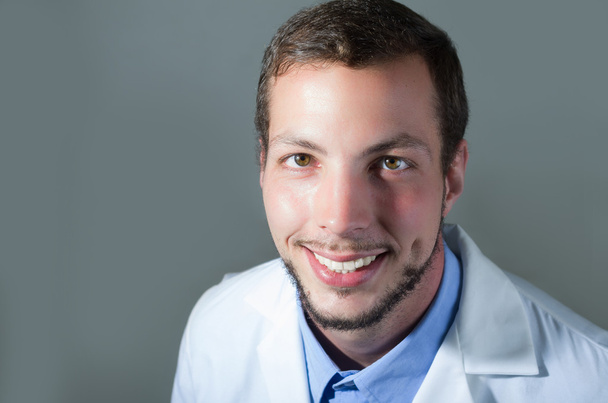 Closeup portrait of handsome young doctor - Foto, Bild