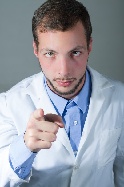 Closeup portrait of handsome young doctor giving a warning - Φωτογραφία, εικόνα