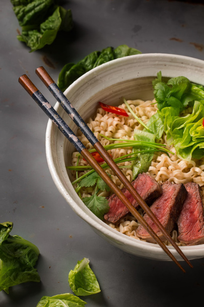A bowl of Chinese ramen noodles with beef, Chinese cabbage, chil - Photo, Image