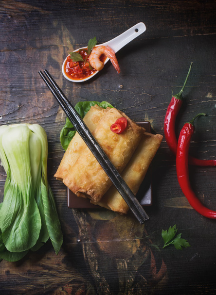 Fried spring rolls with  shrimps, bok choi, chili pepper and hot - Photo, Image