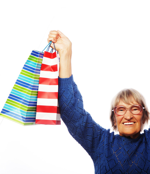 Happy senior woman with shopping bags - Fotoğraf, Görsel