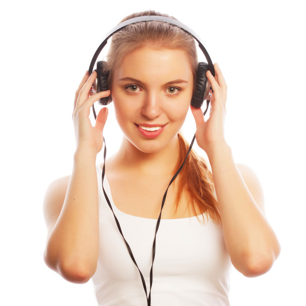 Woman with headphones listening music . - Foto, Imagen