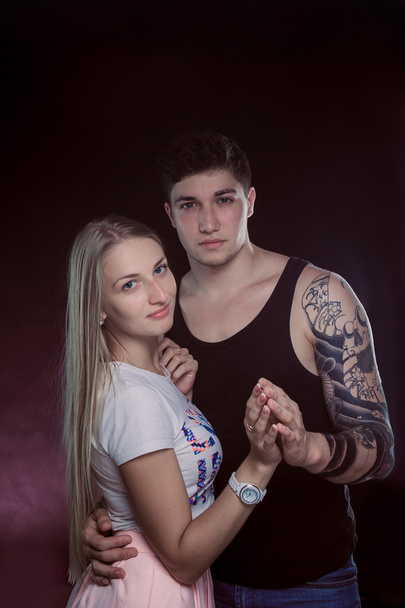 Shot of a passionate loving couple. Over black background. - Valokuva, kuva