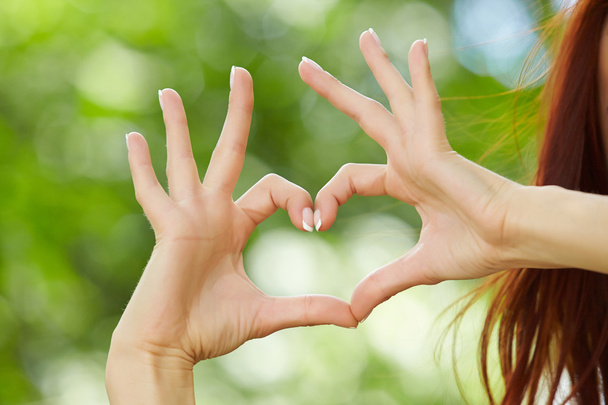 Woman hands making heart sign - Photo, Image