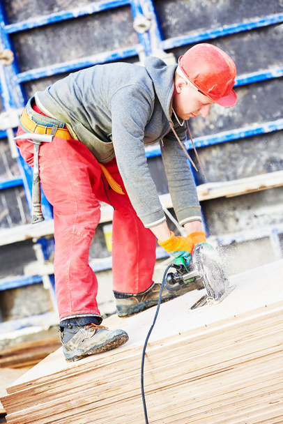 worker cutting plywood by saw machine - Fotografie, Obrázek