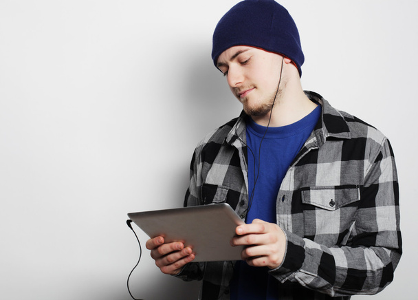 handsome young man working on digital tablet - Foto, Bild