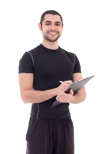portrait of handsome trainer in sportswear with clipboard isolat - Photo, Image