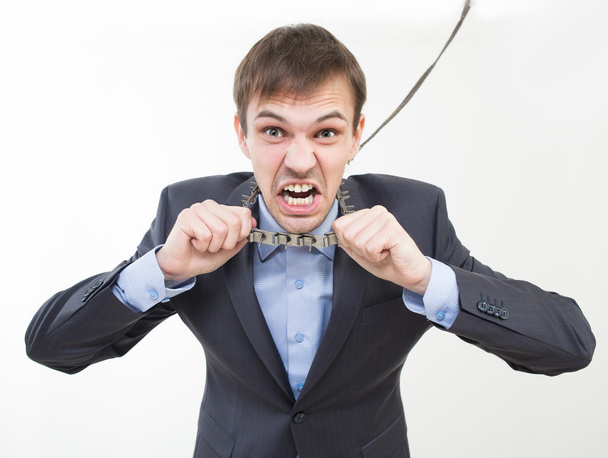 Angry businessman on the chain with a collar. - Foto, imagen