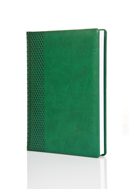 Libro de tapa dura verde en blanco con adorno
 - Foto, Imagen