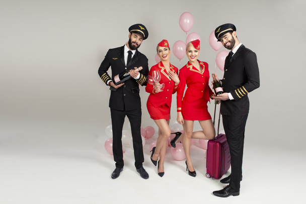 Happy group of pilots and stewardesses - Photo, Image