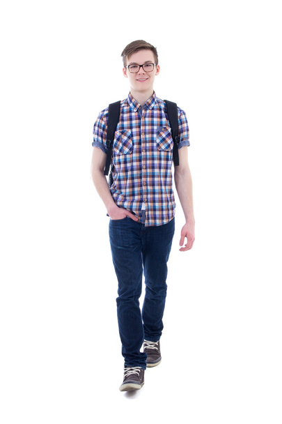 front view of handsome teenage boy with backpack walking isolate - Valokuva, kuva