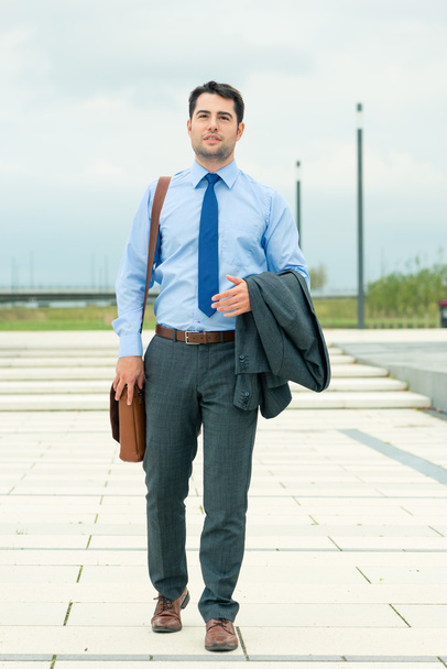 Handsome businessman or manager going home - Photo, Image