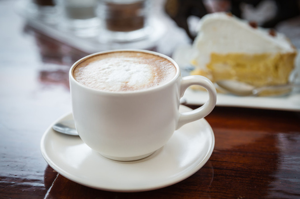A cup of cafe latte and cake - Photo, Image