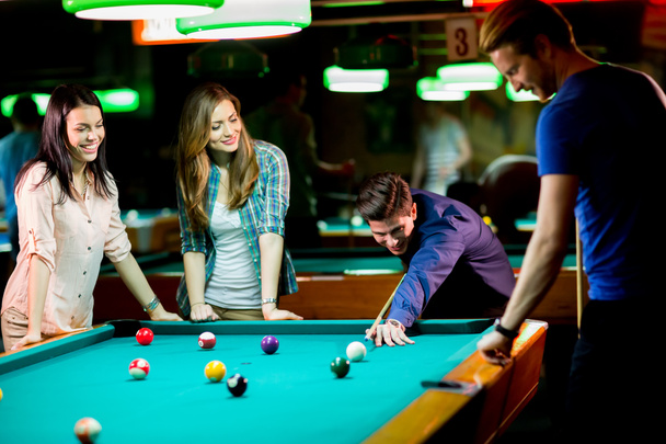 Young people playing pool - Photo, Image